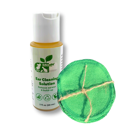 Dog ear cleaning solution bottle with green cotton pads on a white background
